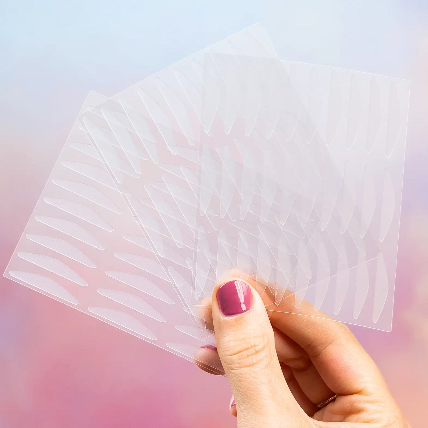 Lifestyle image of a woman wearing GLARISE Corrective Eyelid Strips